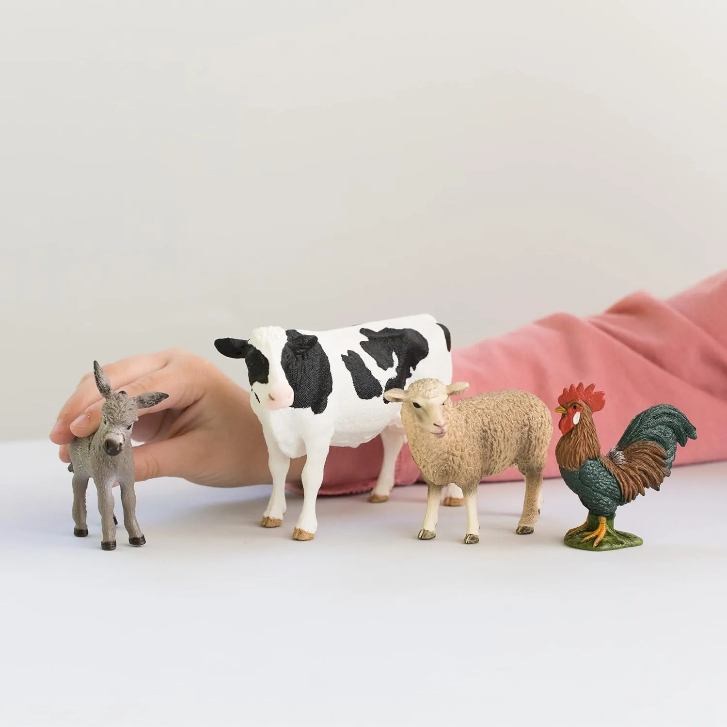 Schleich Farm World - Starter Set, Includes 4 x Collectible Toy Farm Animals, Cow, Sheep, Donkey Foal and Rooster Farm Animal Toys for Kids Ages 3 